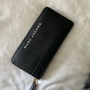 Marc Jacobs black wallet with gold hardware.